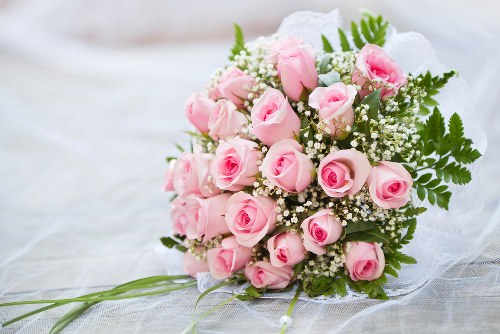 Delivery person holding a bouquet of flowers